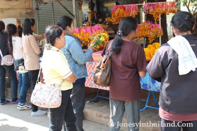 Wat Pho Chai People Buying Incence And Flowers