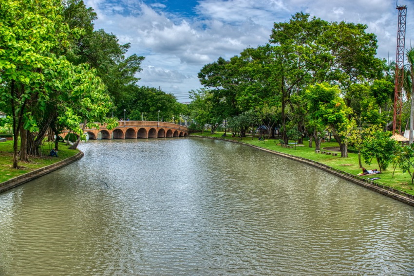 Lake And Bridge At Chatuchak Park In Bangkok