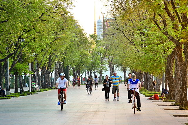Sanam Luang Park In Bangkok With Cyclists Riding Bikes