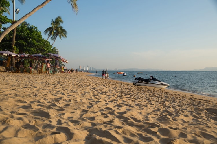 Jomtien Beach With A Low View Of Sand And Sea And Jekski In Background