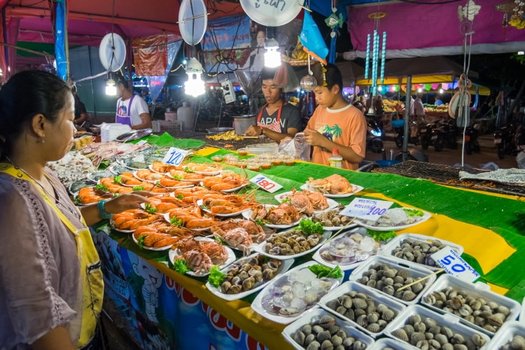 Street Food Seller Selling Seafood In The Night Market In Pattaya