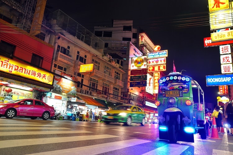 Tuk Tuk And Cars On Yaowarat Road At Nightthe Main Street Of Chinatown In Bangkok