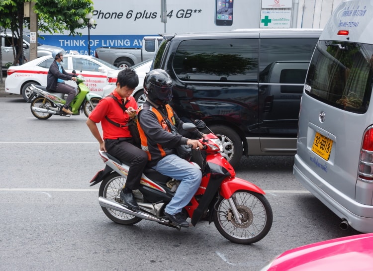 Thailand Motorbike Taxi With Passenger On Phone