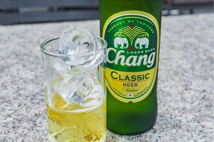 Thailand Chang Beer On Table And Glass With Beer And Ice