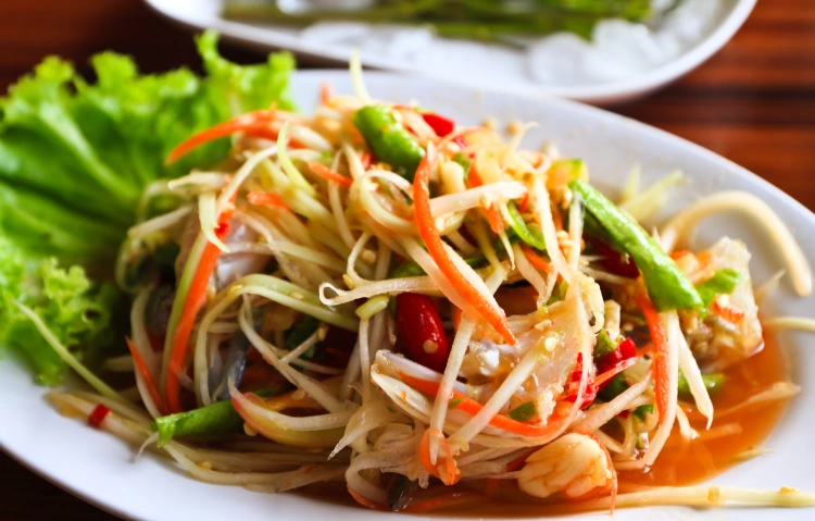 Close Up Of Thai Papaya Salad On White Plate