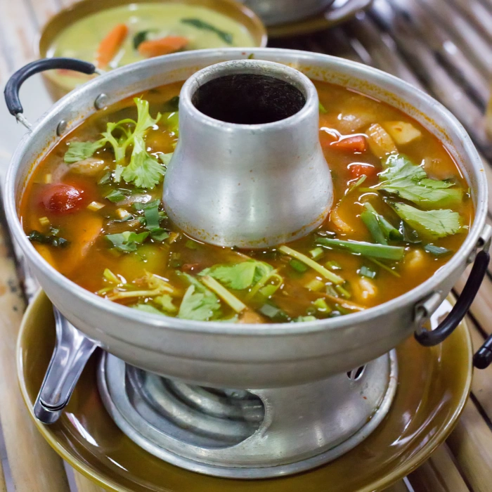 Close Up Of Tom Yam Soup In Metal Heating Bowl
