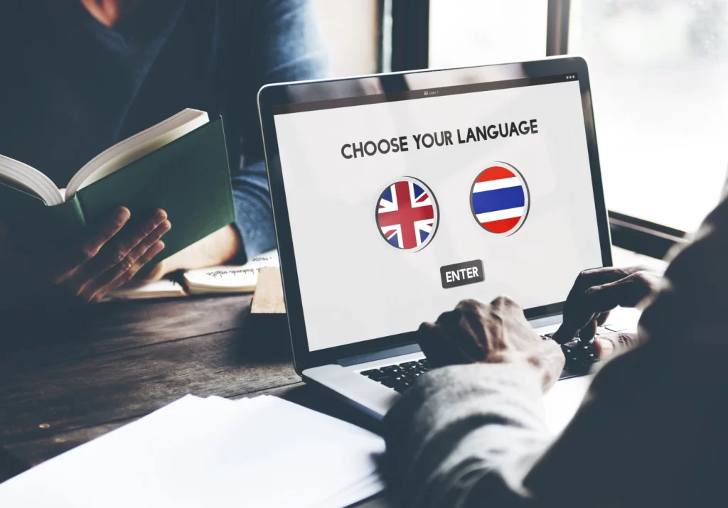 Man Choosing The Language Thai Or English On A Laptop Screen