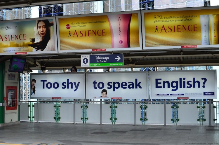 Signs Saying Too Shy To Speak English At On Nut Bts Station In Bangkok