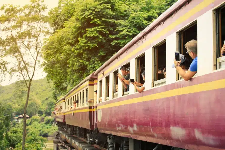 Tourists Taking Pictures On Kanchanaburi Train From Bangkok