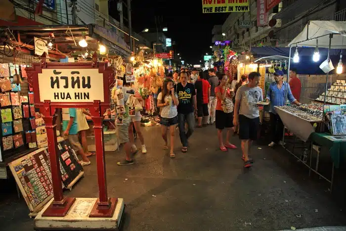 Tourists Visit Hua Hin Night Market With Many Stalls And A Hua Hin Sign