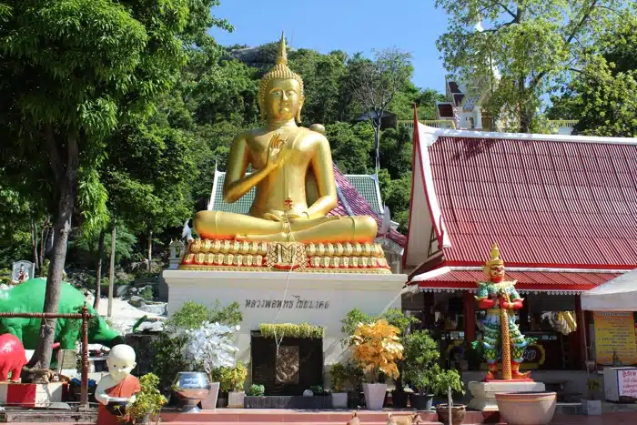 Golden Buddha And Temples At Wat Khao Takiab On A Sunny Day