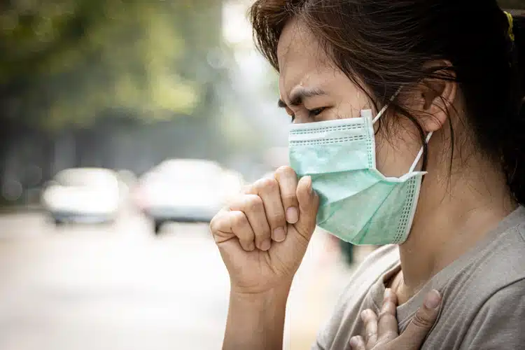 Asian Woman Sweating In Bangkok Thailand Wearing A Face Mask In Hot Weather